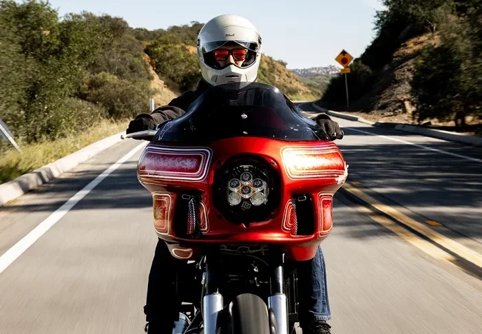 Harley Rider wearing a Biltwell Helmet on a country road