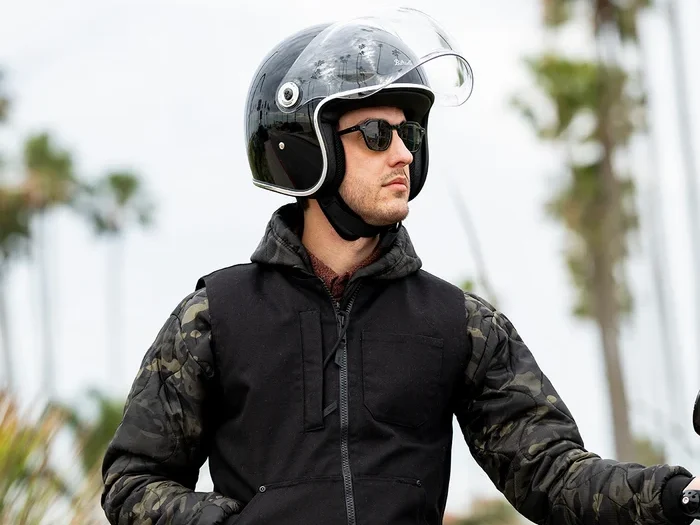Man wearing a Tahoe Helmet with the bubble visor raised up