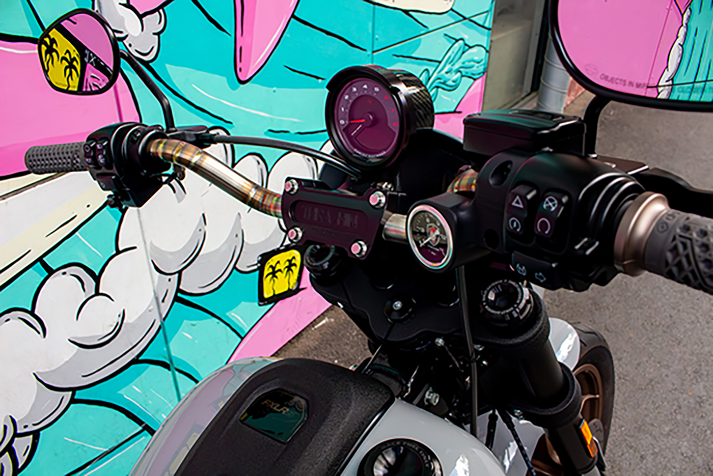 Standard Low Rider S speedo relocated on the Thrashin Supply gauge housing relocation kit
