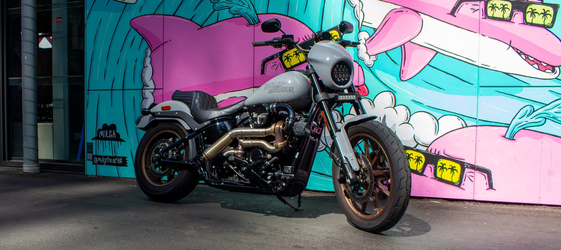 Completed Rollies Speed Shop turbo 2024 Low Rider S build against a painted mural