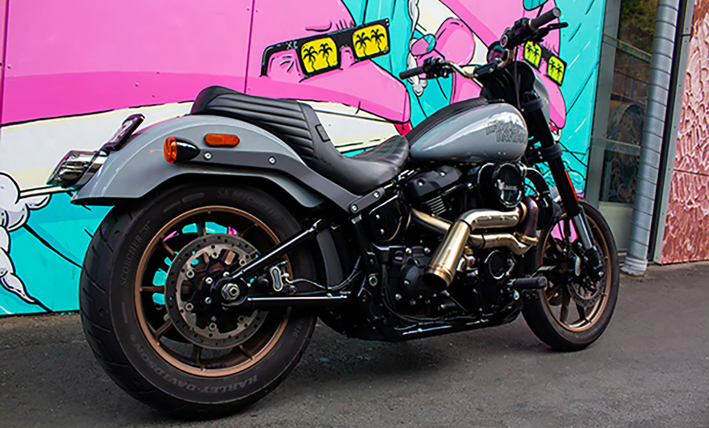 Right side profile of the finished turbocharged 2024 Low Rider S against a painted mural